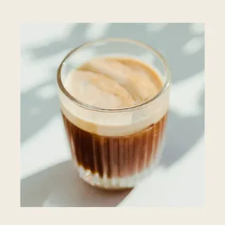 A glass of coffee in morning light